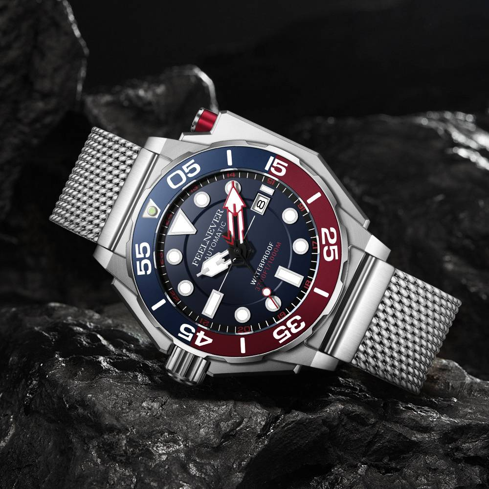 Wristwatch with a silver mesh band and red and blue face on a dark rock background